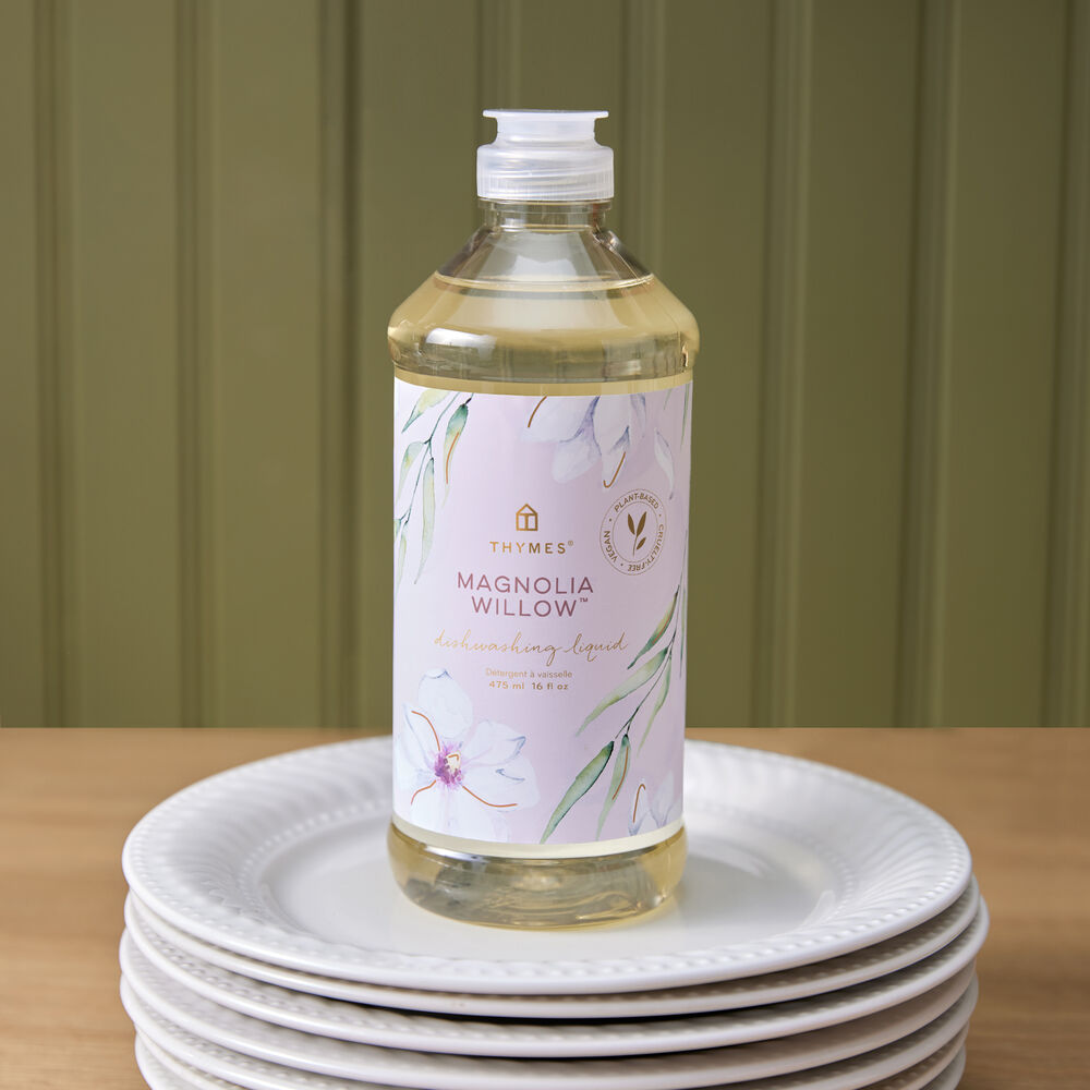 Thymes Magnolia Willow Dishwashing Liquid on a stack of plates image number 1